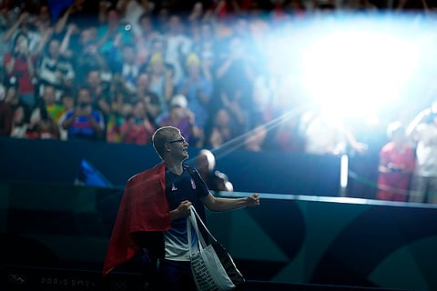 France's Felix Lebrun celebrates after men's singles bronze medal table tennis match